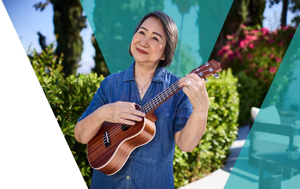 Video: Woman playing a ukulele.